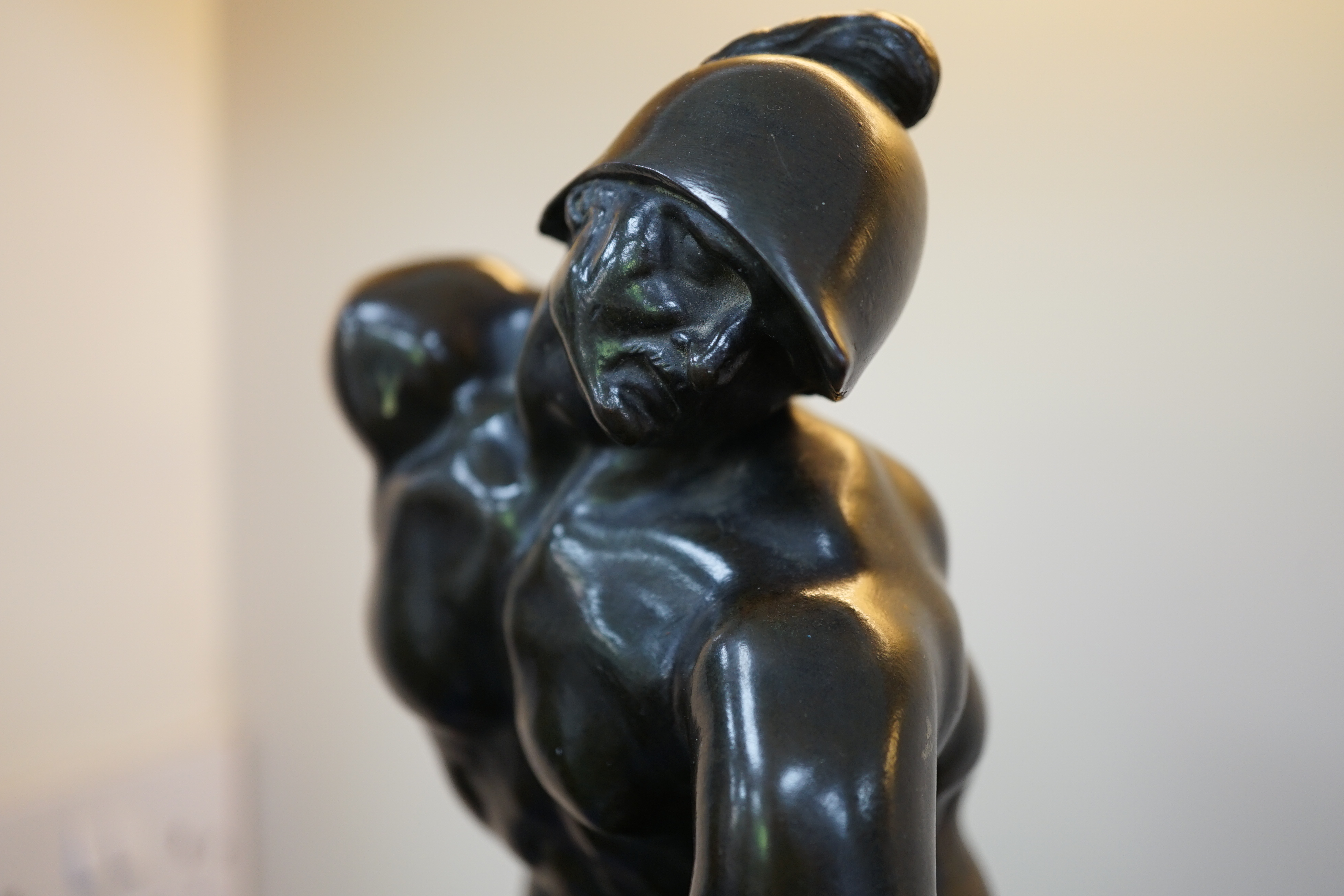 After the antique, a pair of late 18th/early 19th century Grand Tour souvenir bronze figures of seated warriors